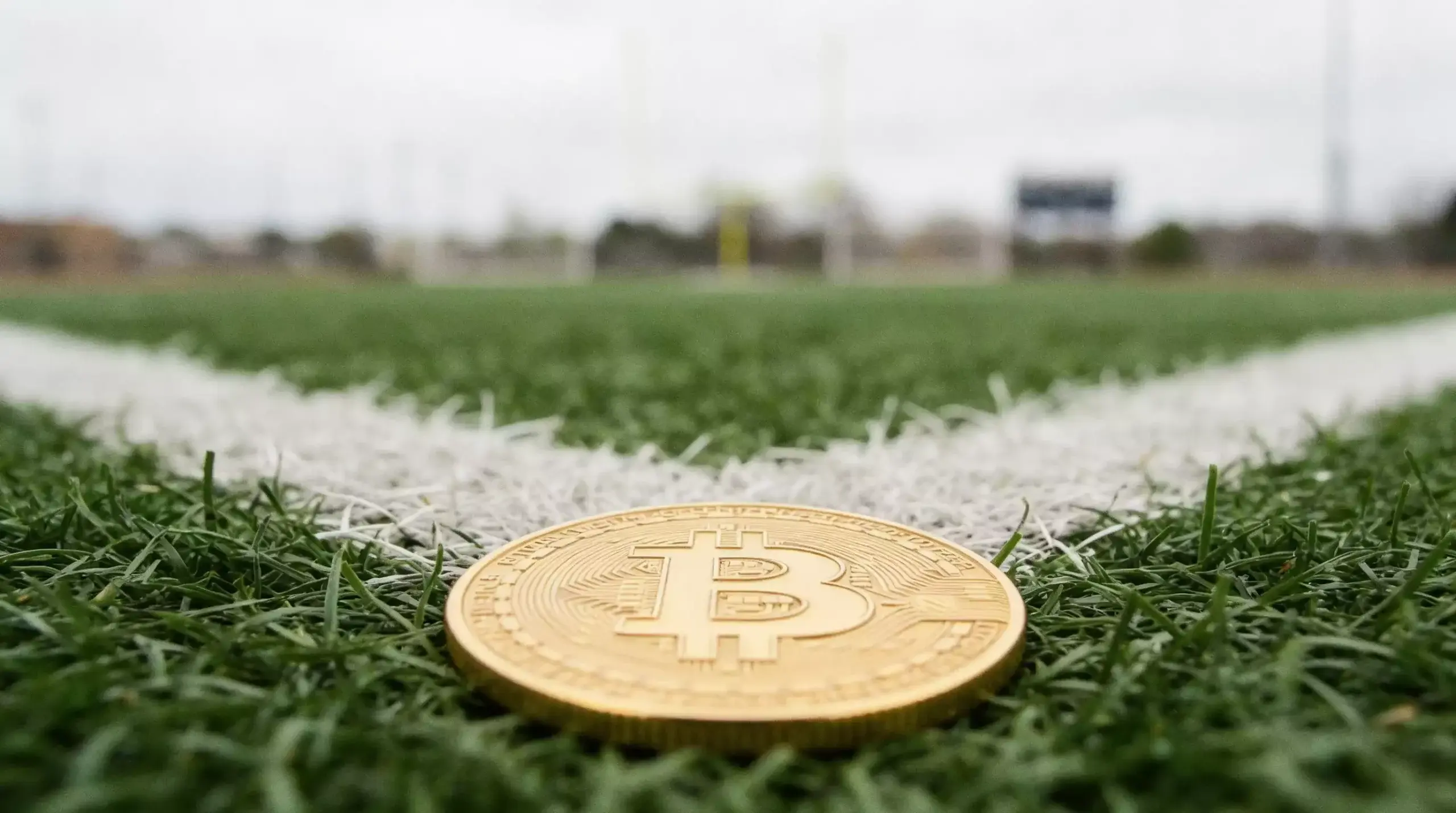 Bitcoin NFL betting showing BTC transaction and American football game odds